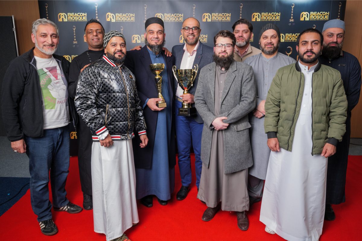 Ashton Central Mosque team receiving the Best Run Mosque trophy at the British Beacon Mosque Awards 2023